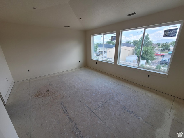 2909 S Richards View Rd Unit 6, Magna, UT 84044 - spare room featuring vaulted ceiling and baseboards