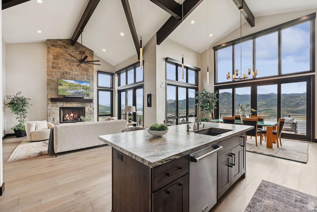 11411 N White Tail Ct, Hideout, UT 84036 - kitchen featuring beam ceiling, high vaulted ceiling, dishwasher, light wood-type flooring, and healthy amount of natural light