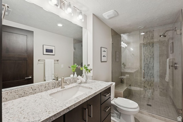 11411 N White Tail Ct, Hideout, UT 84036 - bathroom featuring vanity, a stall shower, a textured ceiling, and recessed lighting