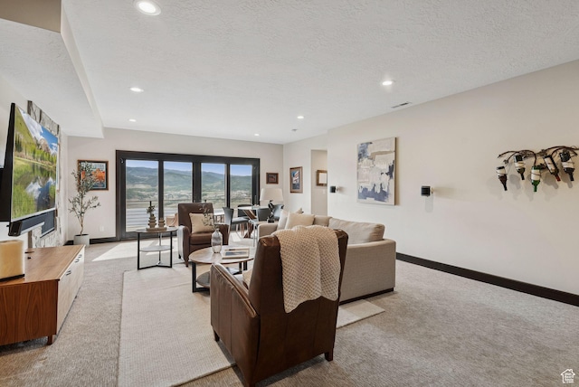 11411 N White Tail Ct, Hideout, UT 84036 - living room featuring light colored carpet, recessed lighting, and a textured ceiling