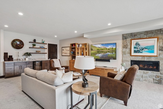 11411 N White Tail Ct, Hideout, UT 84036 - living area featuring beverage cooler, light carpet, recessed lighting, and a fireplace