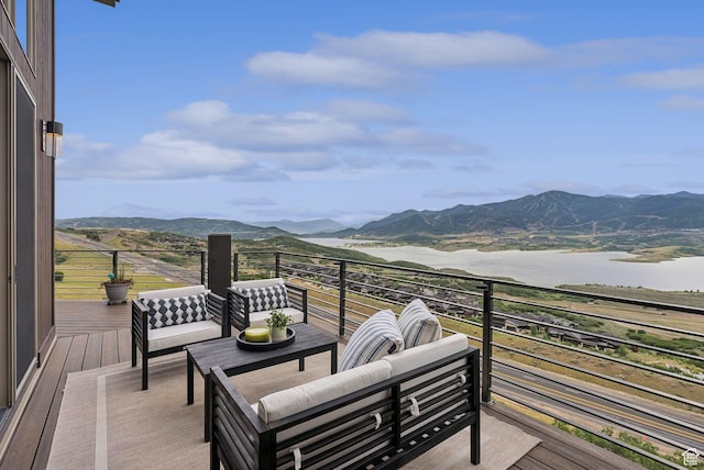 11411 N White Tail Ct, Hideout, UT 84036 - deck featuring a water and mountain view and outdoor lounge area