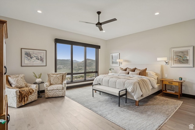 11411 N White Tail Ct, Hideout, UT 84036 - bedroom featuring a mountain view, light wood-style flooring, recessed lighting, and ceiling fan