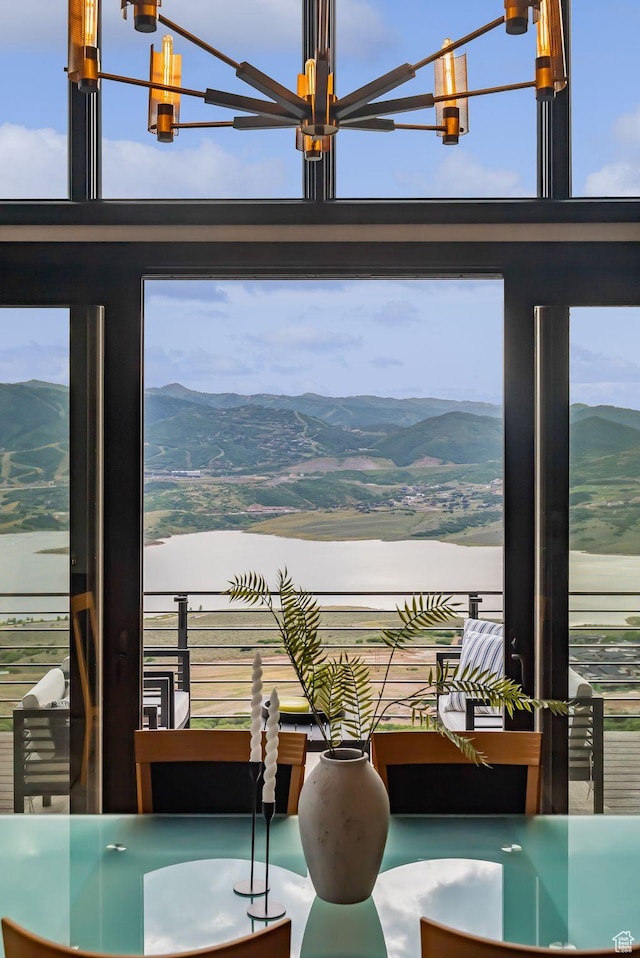 11411 N White Tail Ct, Hideout, UT 84036 - dining area with a chandelier and a mountain view