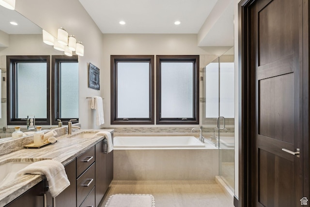 11411 N White Tail Ct, Hideout, UT 84036 - bathroom featuring a garden tub, double vanity, and a shower stall