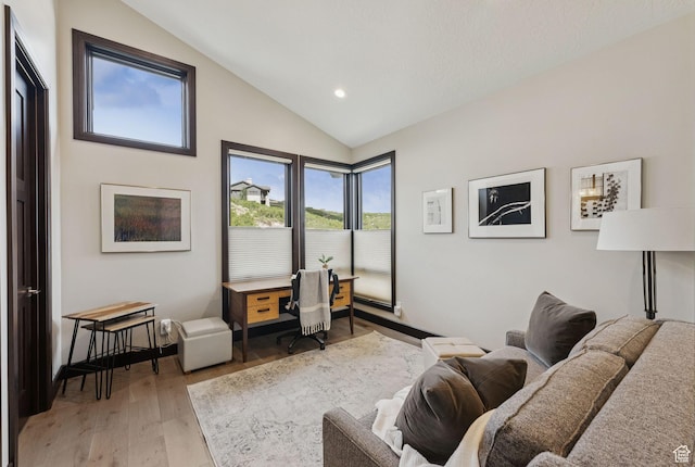 11411 N White Tail Ct, Hideout, UT 84036 - living room with lofted ceiling, light wood-style floors, and recessed lighting