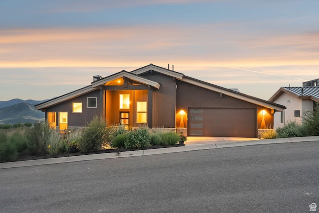 11411 N White Tail Ct, Hideout, UT 84036 - mid-century home featuring a garage and driveway