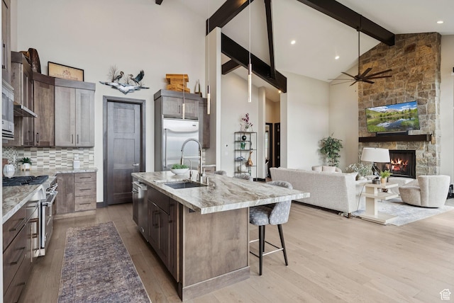 11411 N White Tail Ct, Hideout, UT 84036 - kitchen with premium appliances, high vaulted ceiling, open floor plan, beamed ceiling, and a ceiling fan
