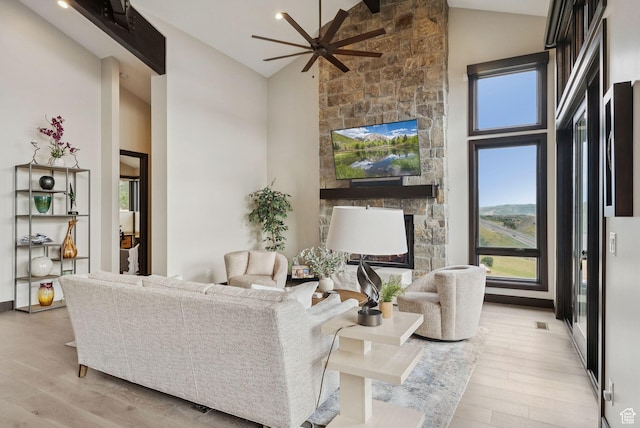 11411 N White Tail Ct, Hideout, UT 84036 - living area featuring wood finished floors, healthy amount of natural light, high vaulted ceiling, and a ceiling fan