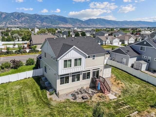 979 N Cold Creek Way, Layton, UT 84041 - rear view of property featuring board and batten siding, a mountain view, a residential view, and roof with shingles