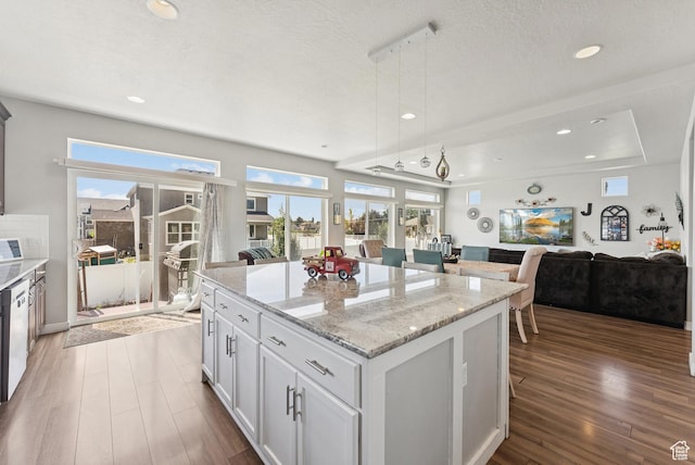 979 N Cold Creek Way, Layton, UT 84041 - kitchen featuring open floor plan, dark wood-style floors, a kitchen island, recessed lighting, and light stone counters