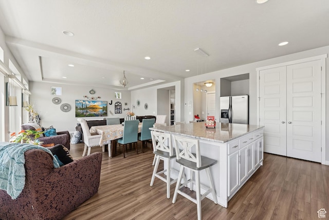 979 N Cold Creek Way, Layton, UT 84041 - kitchen featuring stainless steel refrigerator with ice dispenser, open floor plan, white cabinets, wood finished floors, and recessed lighting