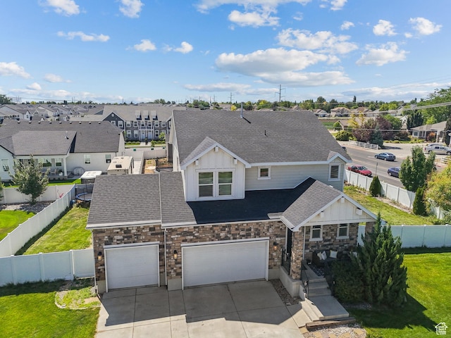 979 N Cold Creek Way, Layton, UT 84041 - view of front of house featuring board and batten siding, a residential view, driveway, roof with shingles, and stone siding