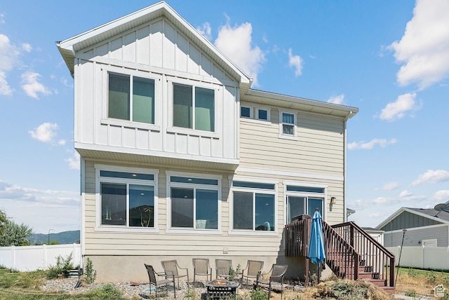 979 N Cold Creek Way, Layton, UT 84041 - rear view of house with a fire pit and board and batten siding