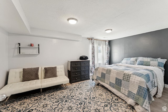 979 N Cold Creek Way, Layton, UT 84041 - bedroom featuring a textured ceiling and wood finished floors
