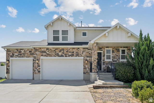 979 N Cold Creek Way, Layton, UT 84041 - view of front of property featuring board and batten siding, concrete driveway, stone siding, and a garage
