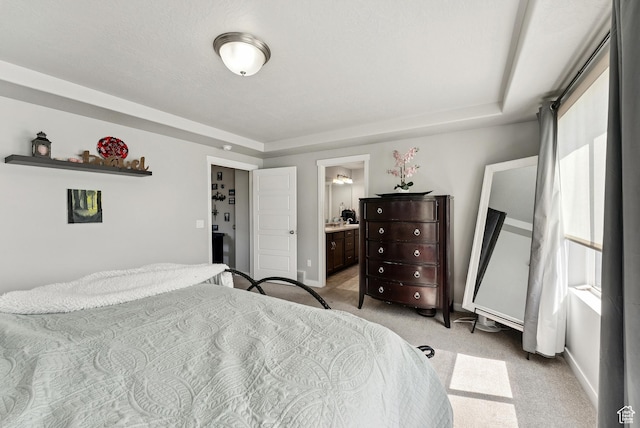 979 N Cold Creek Way, Layton, UT 84041 - bedroom featuring light carpet, a raised ceiling, and connected bathroom