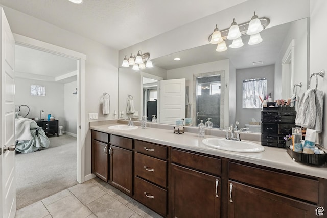 979 N Cold Creek Way, Layton, UT 84041 - bathroom with double vanity, connected bathroom, a stall shower, and plenty of natural light
