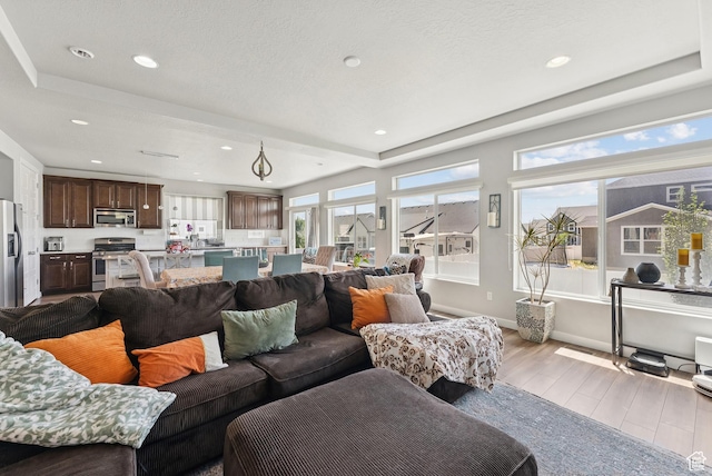 979 N Cold Creek Way, Layton, UT 84041 - living room with wood finished floors, plenty of natural light, and recessed lighting