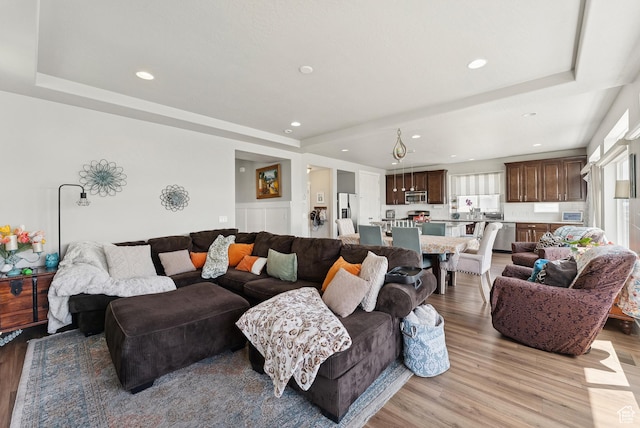 979 N Cold Creek Way, Layton, UT 84041 - living area with a tray ceiling, light wood-type flooring, and recessed lighting