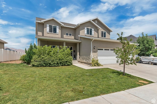 342 W Royal Land Dr, Santaquin, UT 84655 - traditional home with stucco siding, stone siding, concrete driveway, and an attached garage