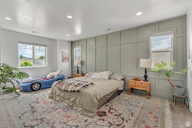 342 W Royal Land Dr, Santaquin, UT 84655 - bedroom featuring a decorative wall, recessed lighting, and wood finished floors