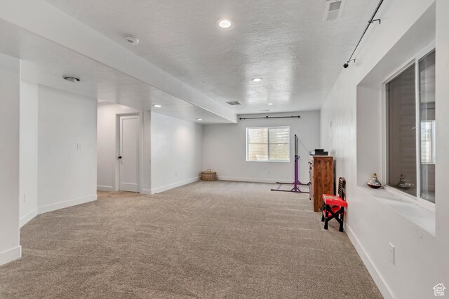 342 W Royal Land Dr, Santaquin, UT 84655 - empty room with carpet floors, a textured ceiling, and recessed lighting