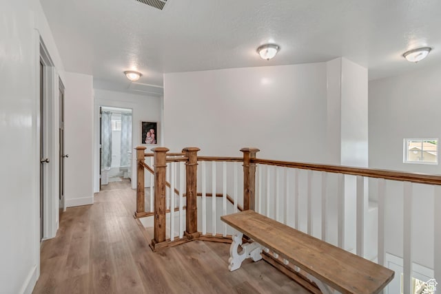 342 W Royal Land Dr, Santaquin, UT 84655 - hall featuring light wood-type flooring, an upstairs landing, and a textured ceiling