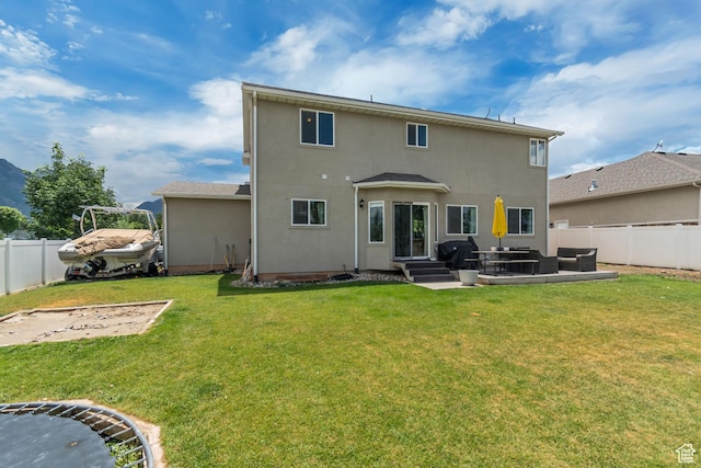 342 W Royal Land Dr, Santaquin, UT 84655 - back of house featuring a fenced backyard, stucco siding, an outdoor living space, and a patio