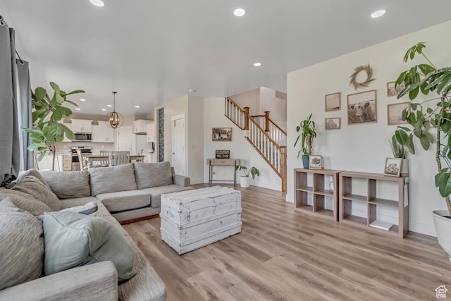 342 W Royal Land Dr, Santaquin, UT 84655 - living area with stairway, light wood-type flooring, and recessed lighting