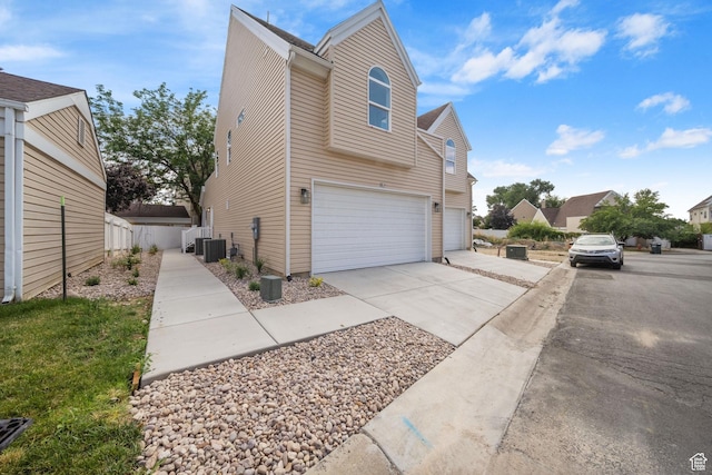 762 E Gables St S Unit 101, Midvale, UT 84047 - view of side of home featuring a garage and driveway