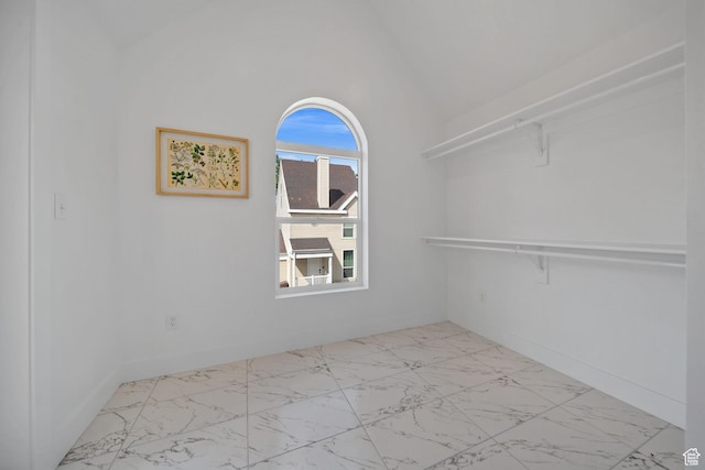 762 E Gables St S Unit 101, Midvale, UT 84047 - walk in closet featuring marble look tile flooring and vaulted ceiling