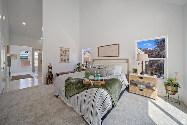 762 E Gables St S Unit 101, Midvale, UT 84047 - bedroom featuring carpet floors, a high ceiling, and ensuite bath