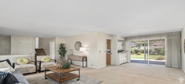 678 W 650 S, Orem, UT 84058 - living area featuring light colored carpet, wallpapered walls, and stairs