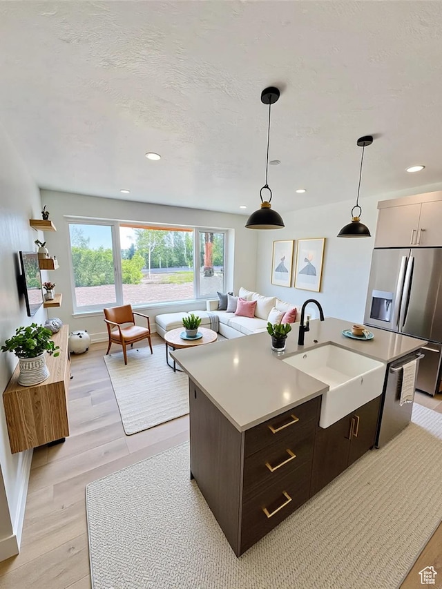 70 E Hwy 153 Unit A4, Beaver, UT 84713 - kitchen featuring appliances with stainless steel finishes, light countertops, decorative light fixtures, light wood-style flooring, and recessed lighting