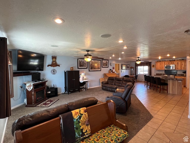 251 N 580 W, Monroe, UT 84754 - living room with ceiling fan, a textured ceiling, and light tile patterned floors