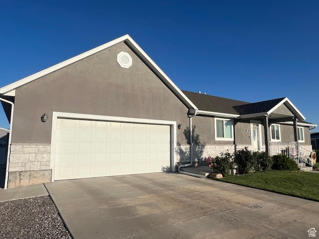251 N 580 W, Monroe, UT 84754 - ranch-style home featuring an attached garage, driveway, stucco siding, and stone siding