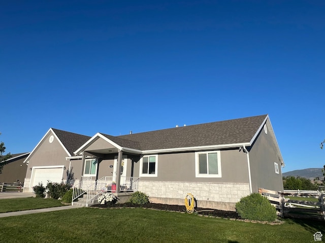 251 N 580 W, Monroe, UT 84754 - ranch-style house featuring an attached garage, stucco siding, and stone siding