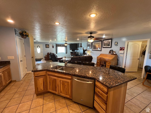 251 N 580 W, Monroe, UT 84754 - kitchen with stainless steel dishwasher, a textured ceiling, open floor plan, brown cabinets, and a ceiling fan