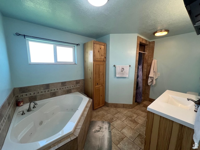 251 N 580 W, Monroe, UT 84754 - full bathroom featuring a tub with jets, a textured ceiling, a tile shower, and vanity