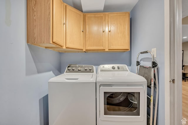9078 S Harkness Dr W, West Jordan, UT 84088 - laundry area featuring cabinet space, washing machine and dryer, and wood finished floors