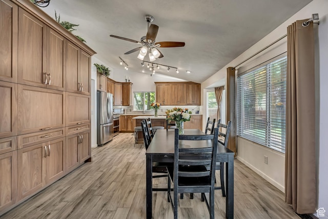 9078 S Harkness Dr W, West Jordan, UT 84088 - dining area with light wood-style flooring, ceiling fan, and vaulted ceiling