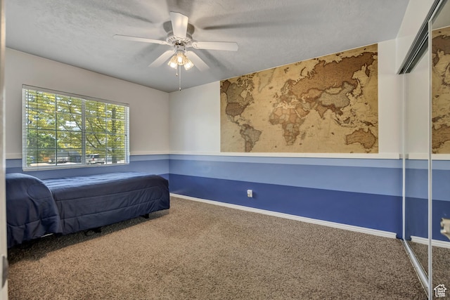 9078 S Harkness Dr W, West Jordan, UT 84088 - unfurnished bedroom with carpet floors, a textured ceiling, and a ceiling fan