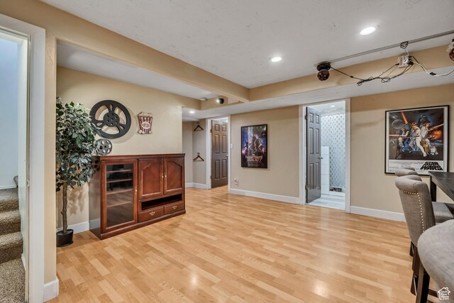 9078 S Harkness Dr W, West Jordan, UT 84088 - living area featuring light wood finished floors, recessed lighting, and stairs