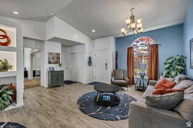 9078 S Harkness Dr W, West Jordan, UT 84088 - living area with a chandelier, light wood-type flooring, lofted ceiling, and recessed lighting