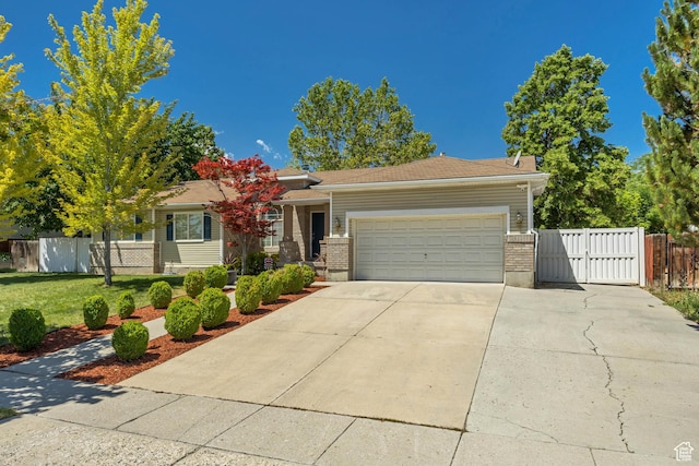 9078 S Harkness Dr W, West Jordan, UT 84088 - view of front of property with a gate, an attached garage, and driveway