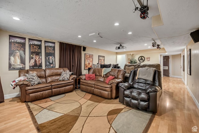 9078 S Harkness Dr W, West Jordan, UT 84088 - living area featuring wood finished floors, recessed lighting, and a textured ceiling