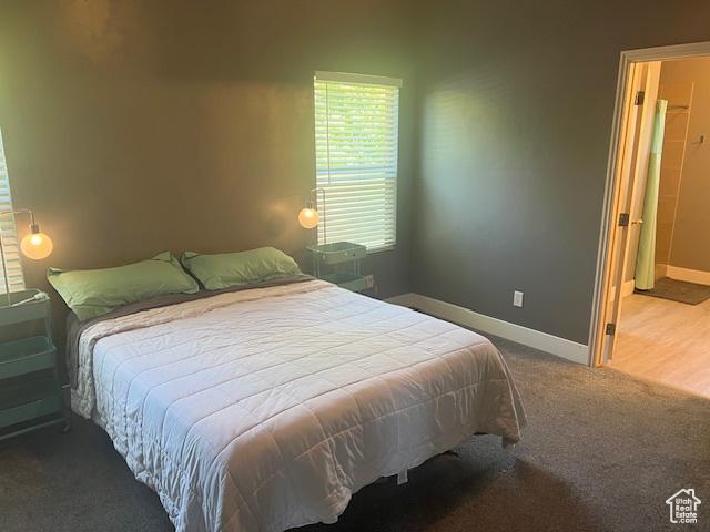 5298 W Icehouse Way, West Jordan, UT 84081 - carpeted bedroom with baseboards