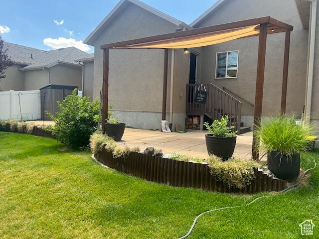 5298 W Icehouse Way, West Jordan, UT 84081 - rear view of property featuring stucco siding and a patio area