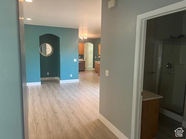 5298 W Icehouse Way, West Jordan, UT 84081 - hall featuring arched walkways and light wood-style flooring